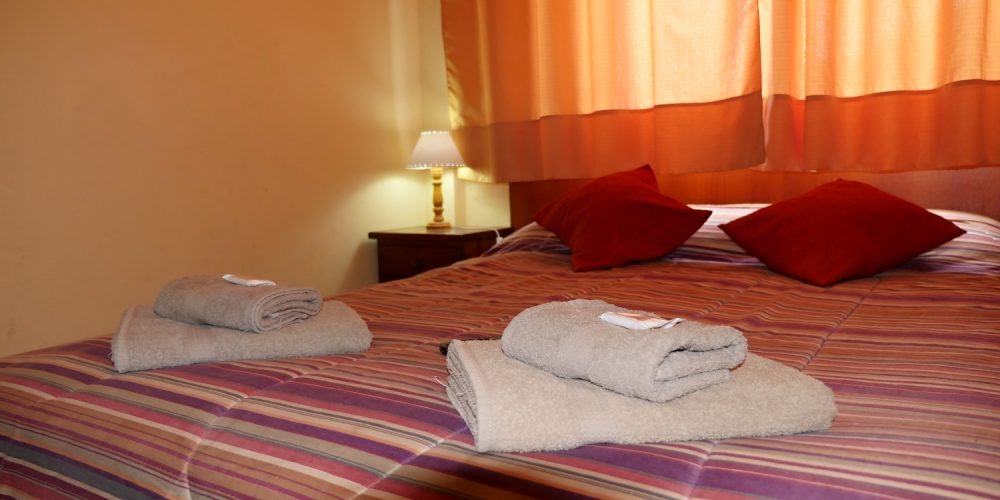 Habitación con blanquería